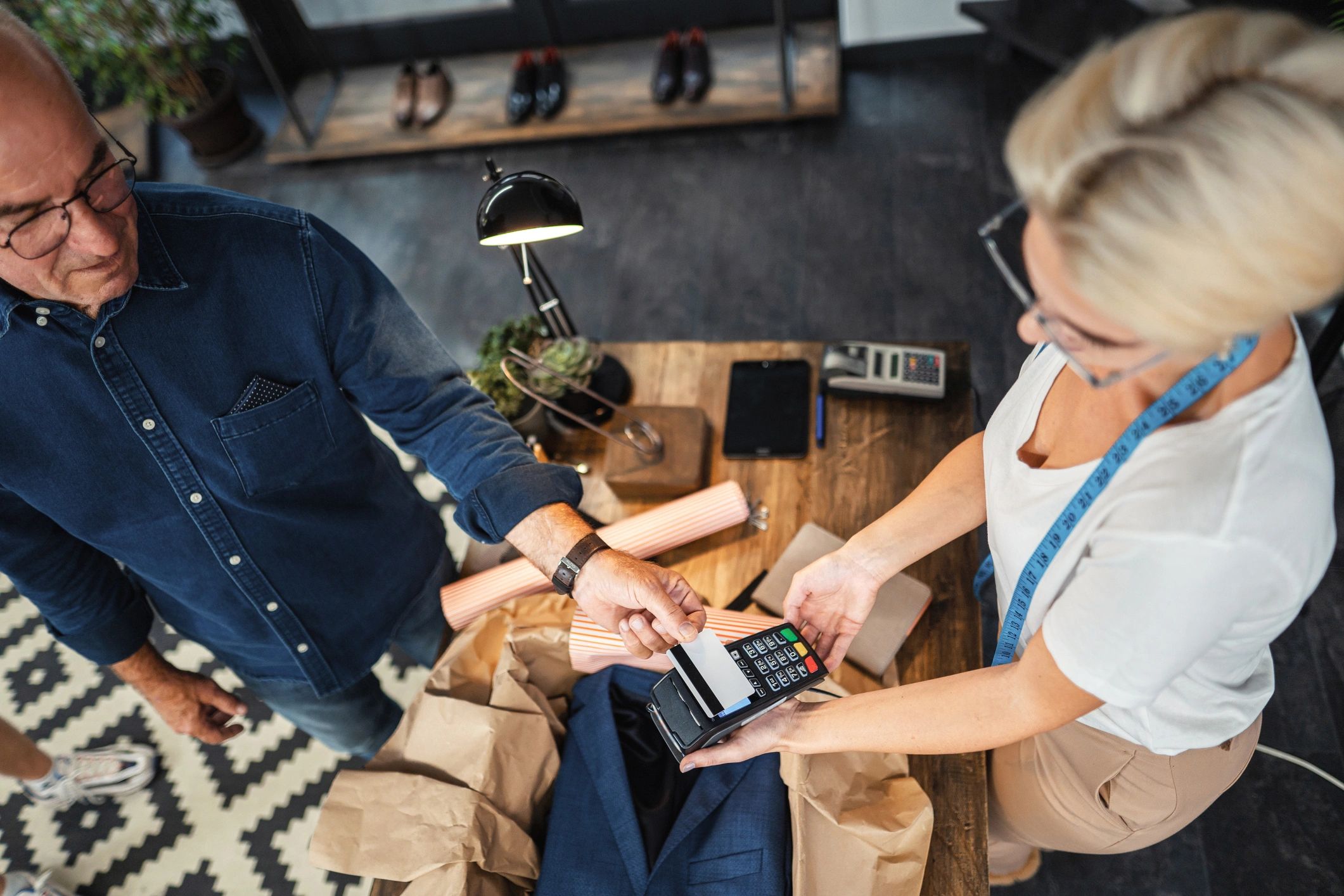 Customer paying at a retail counter