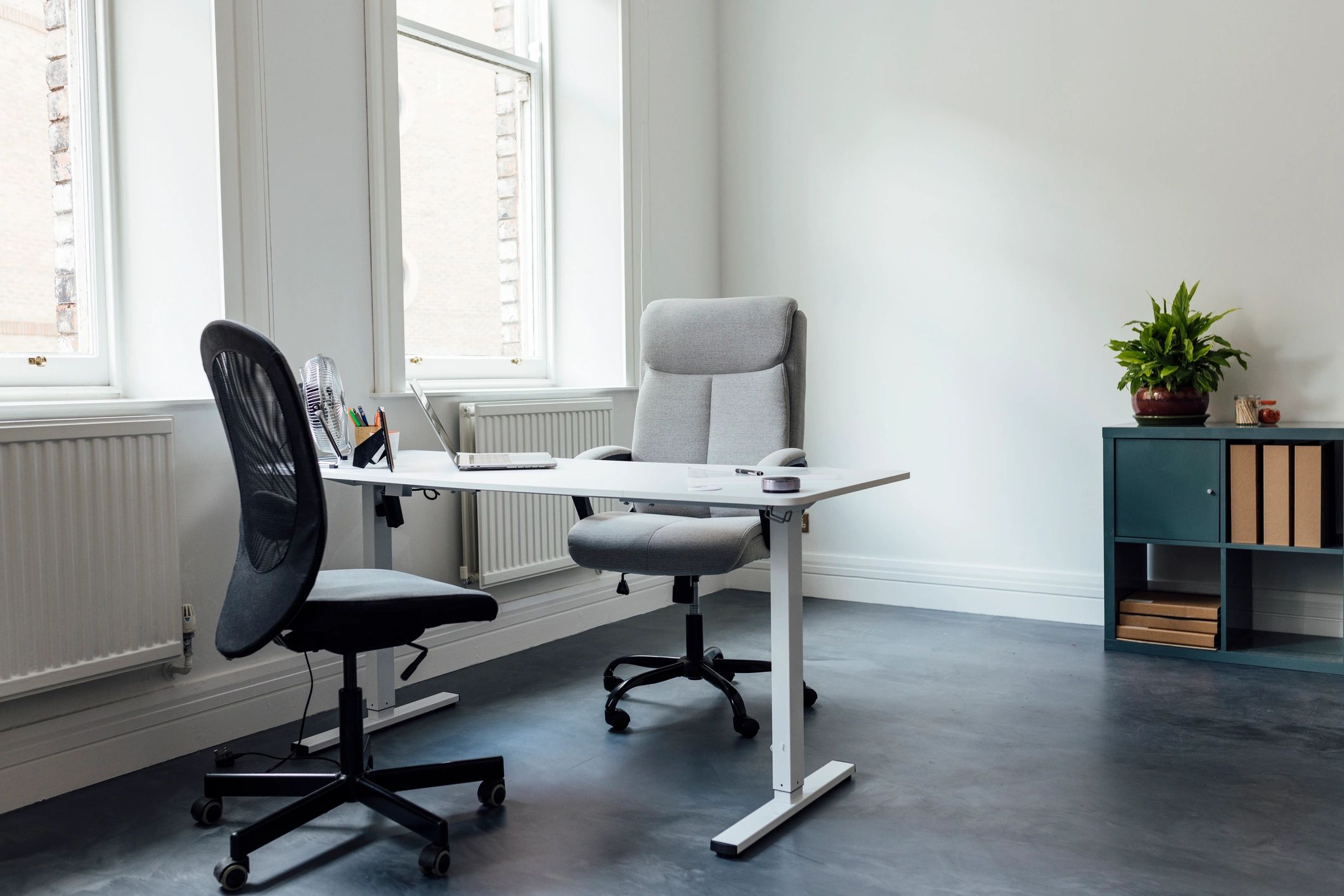 Office desk with laptop, representing software research and evaluation