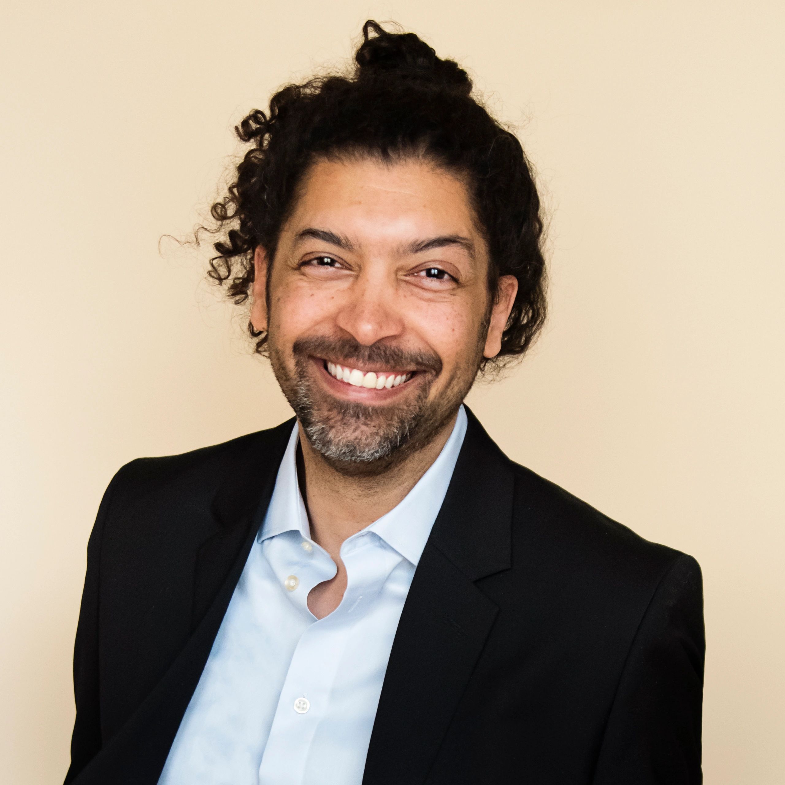 Headshot of a modern professional man with beard