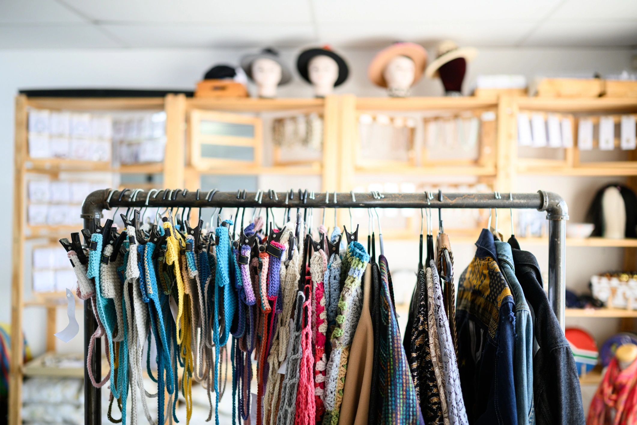 Clothing rack and boutique shelving, representing inventory and shop operations